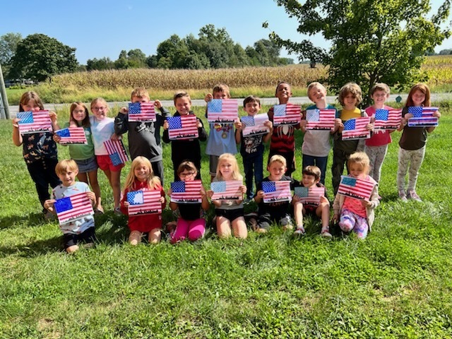 3rd grade class with flag artwork